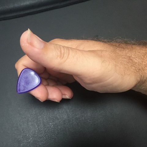 How to hold a guitar